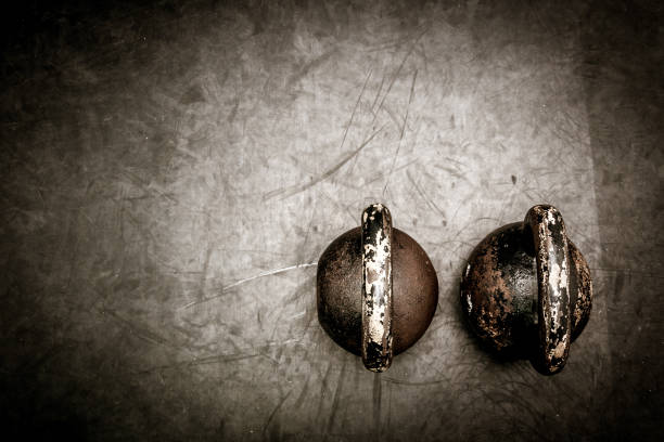istock Kettle bells on the gym floor. Workout equipment. Kettle bell training background. 700310632