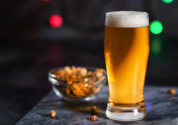 glass of cold beer - beer nuts imagens e fotografias de stock
