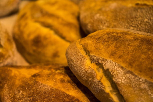 istock Bread loaves. Loaf of bread. Fresh bread in bakery. Bread loaves background 700319680
