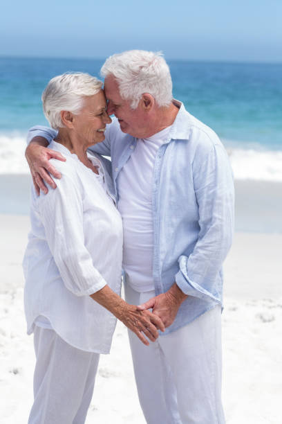 istock Senior couple embracing head to head 700336834