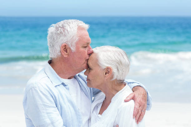 istock Senior couple embracing and kissing 700341382