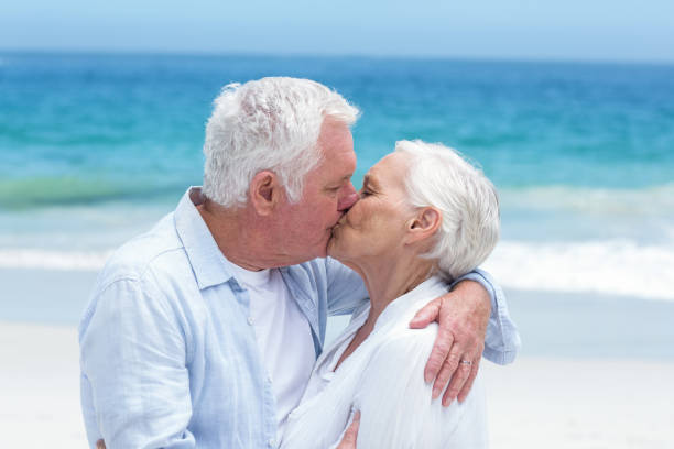 istock Senior couple embracing and kissing 700341400