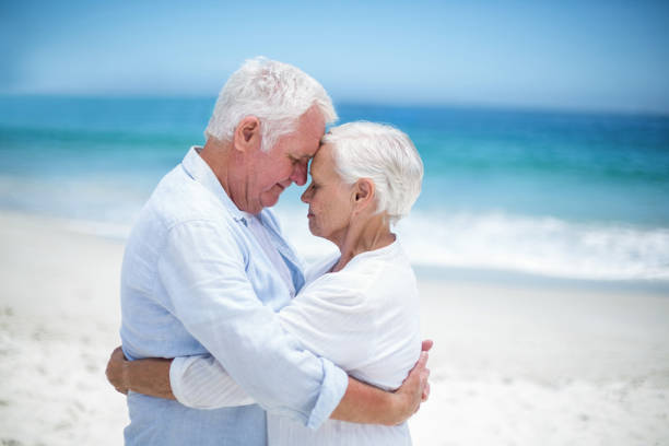 istock Senior couple embracing head to head 700341630