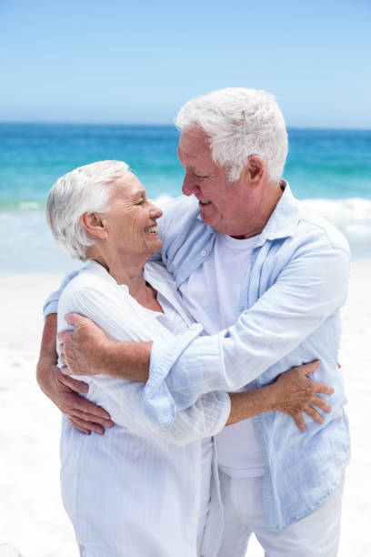 istock Senior couple embracing and looking to each other 700341822