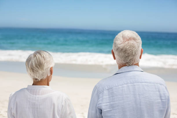 istock Rear view of a senior couple holding hands 700342046