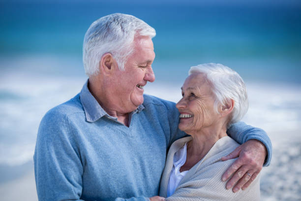 istock Senior couple embracing and looking at each other 700342116