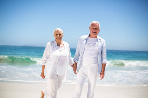 istock Senior couple holding hands 700342194