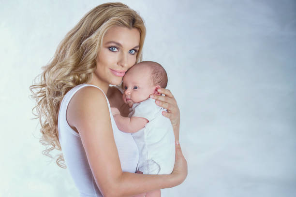 istock Young mother with little baby. 700350840