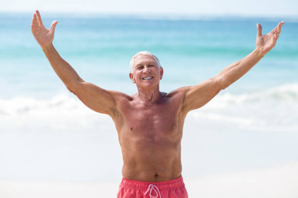 istock Handsome mature man outstretching his arms 700350848