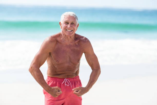 istock Handsome mature man showing his muscles 700350886