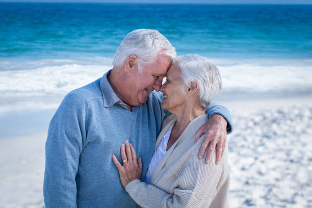 istock Cute mature couple cuddling 700352226