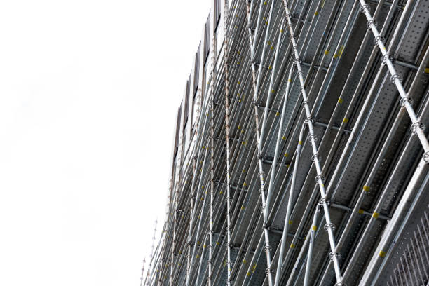 Giant scaffolding, mobile metal scaffold. The building is under construction, with metal scaffolding.