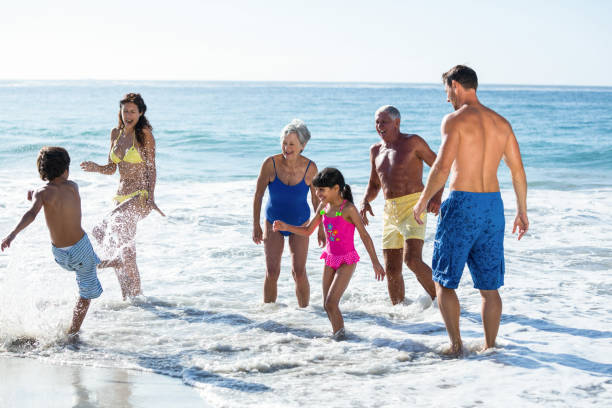 istock Happy family playing with waves 700377860
