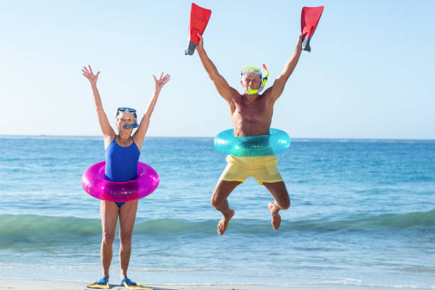 istock Senior couple with beach equipment 700378670