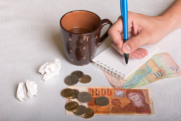 istock Macedonian money, cup of coffee and man's hand 700378736