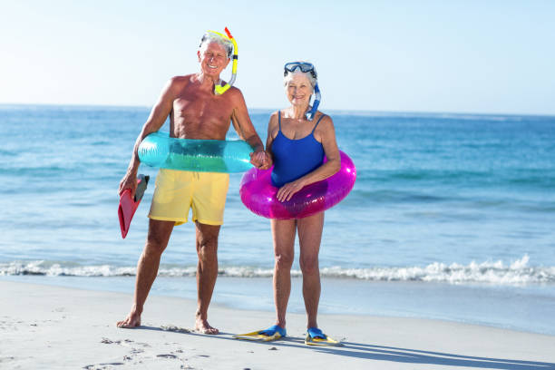 istock Senior couple with beach equipment 700378776