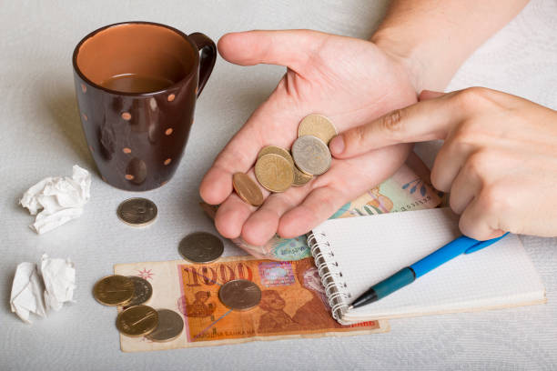 macedonian money on man's palm and cup of coffee - denar imagens e fotografias de stock