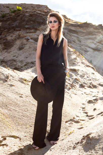 istock girl standing in desert 700387996