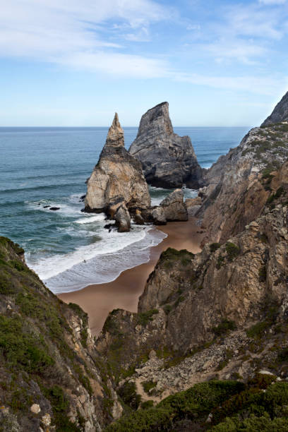 Ursa Beach in Sintra The Ursa Beach (Praia da Ursa) is a natural treasure at the end of a difficult cliff descent located in the Sintra Mountain, near Lisbon, Portugal serra de sintra stock pictures, royalty-free photos & images