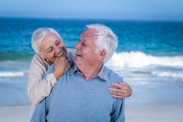 istock Senior couple embracing at the beach 700399492