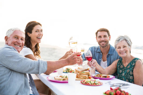 istock Happy family having a picnic at the beach 700415548