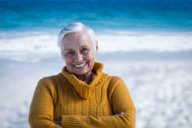 istock Senior woman posing with crossed arms 700415568