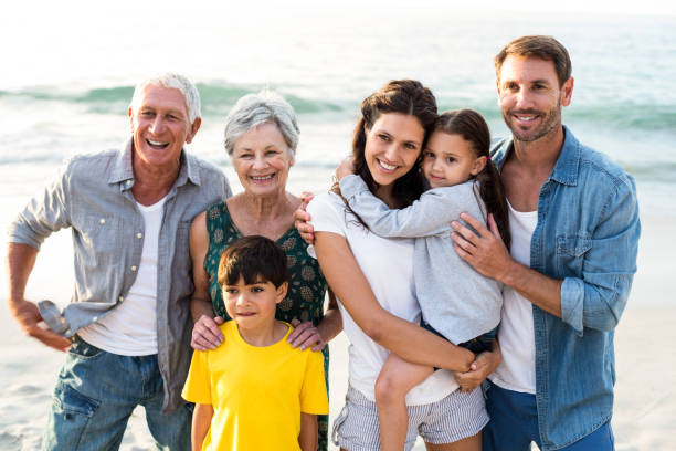 istock Happy family posing at the beach 700415656