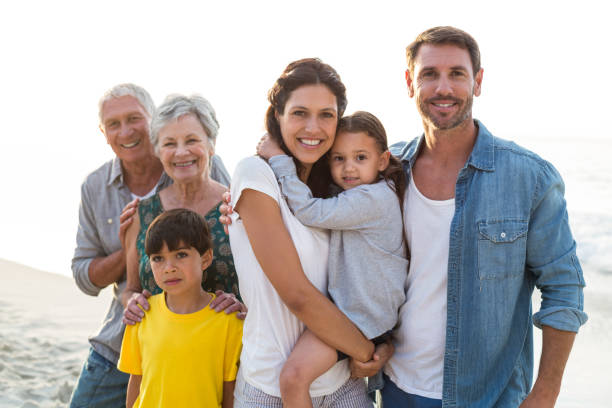 istock Happy family posing at the beach 700415664