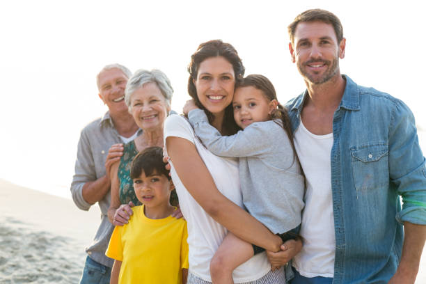 istock Happy family posing at the beach 700415690