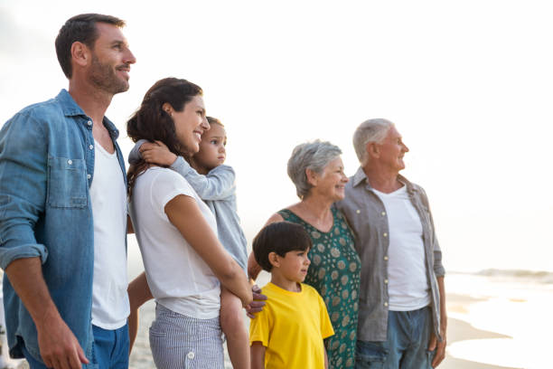 istock Happy family posing at the beach 700415884