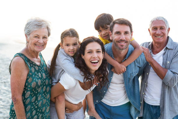 istock Happy family posing at the beach 700415916
