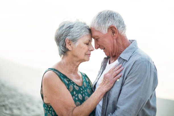 istock Senior couple embracing 700417964