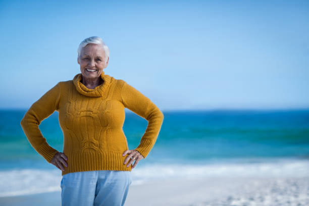 istock Senior woman posing with hands on hips 700432746