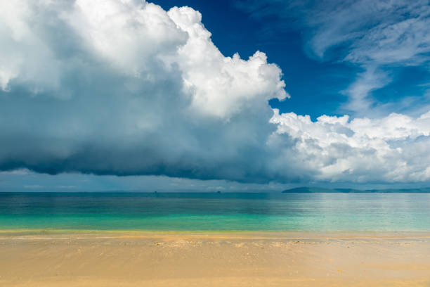 istock Blue rain clouds hover over the calm sea of Thailand 700451066