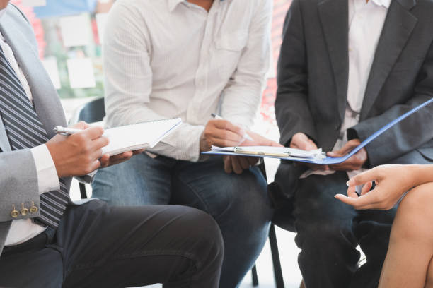 istock young business people having a meeting in office. Conference, discussion, teamwork, collaboration, corporate concept. 700451248