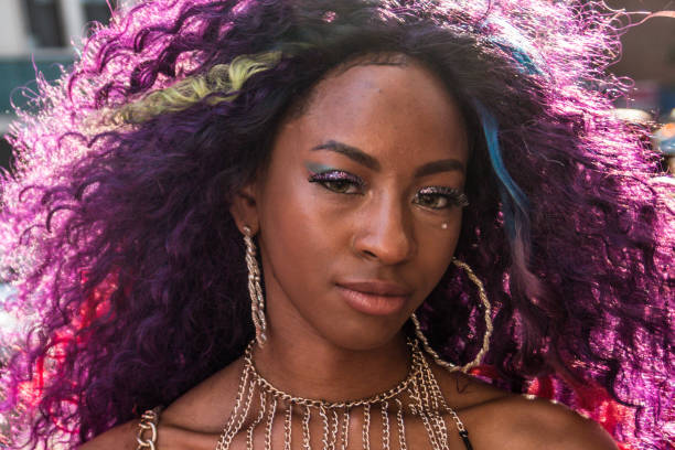 Portrait of participant in pink hair and festive outfit in the Pride Parade, New York City 2016.