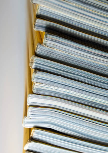istock Stack of yellow monthly magazine 700470398