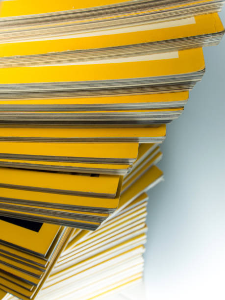 istock Stack of yellow monthly magazine 700470412