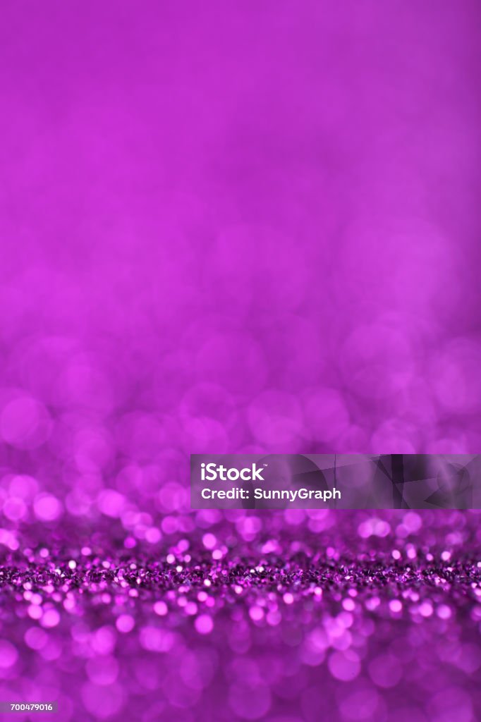 Abstract Purple Defocused Lights Background Abstract background of purple glittering defocused lights. Abstract Stock Photo