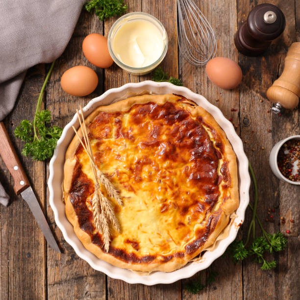 istock quiche with ingredient on wooden background 700479378