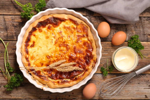 istock quiche with ingredient on wooden background 700479394