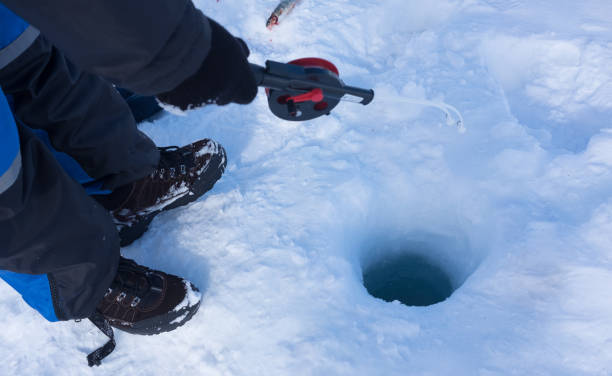 istock ice fishing in northen norway 700485094