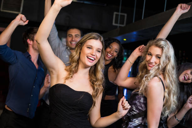 istock Happy friends dancing together 700492270