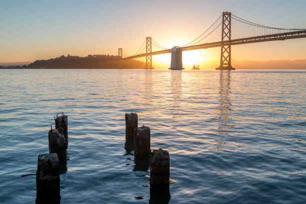 istock Six Pillars sticking out the water with Bay Bridge in the background 700497640