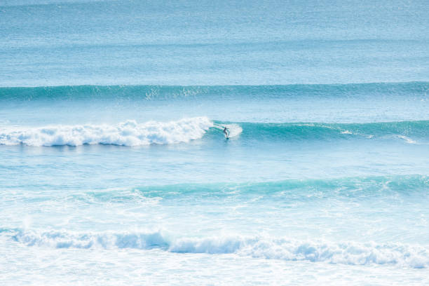 Surfing time in Bali lots of people study surfing in kuta beach, Bali. kuta beach stock pictures, royalty-free photos & images