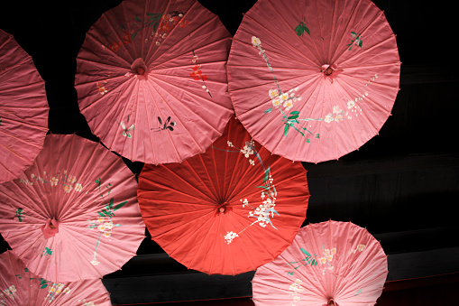 Colorful Oriental hand-painted umbrellas in arrangement.