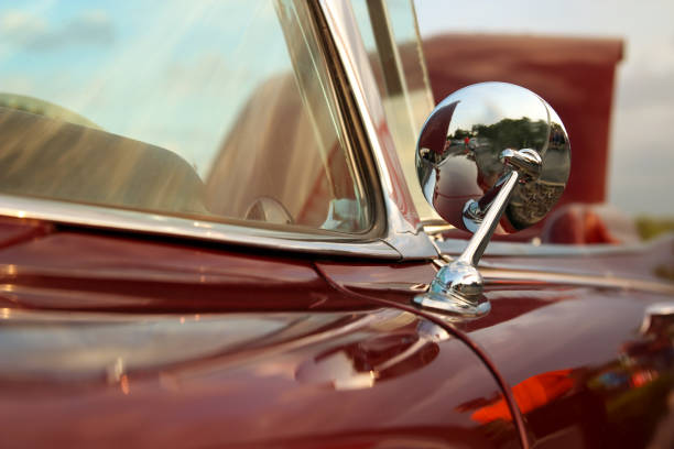istock classic retro vintage red car. Car mirror 700522440