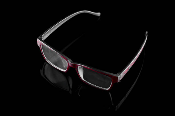 istock Unique glasses with wood texture frame over  black background 700531046
