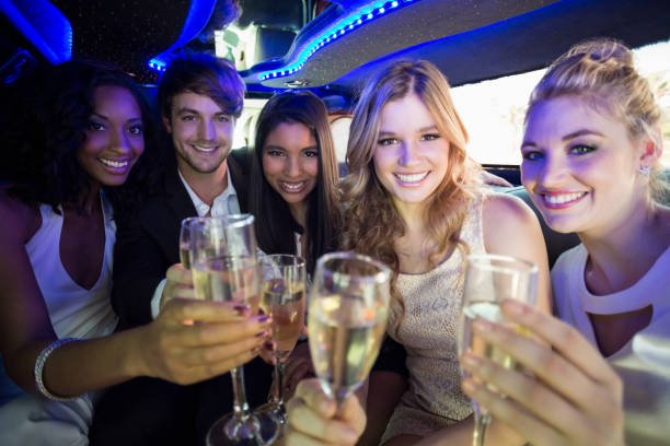 istock Happy friends drinking champagne 700558744