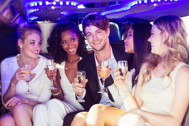 istock Happy friends drinking champagne 700558942